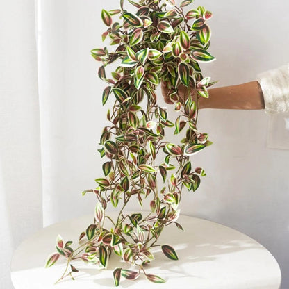 75cm Artificial Vines Leaves cascading from a hand, perfect for home decor and adding greenery