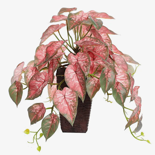 Nutshell Artificial Vines Leaves in a decorative pot with vibrant pink and green foliage