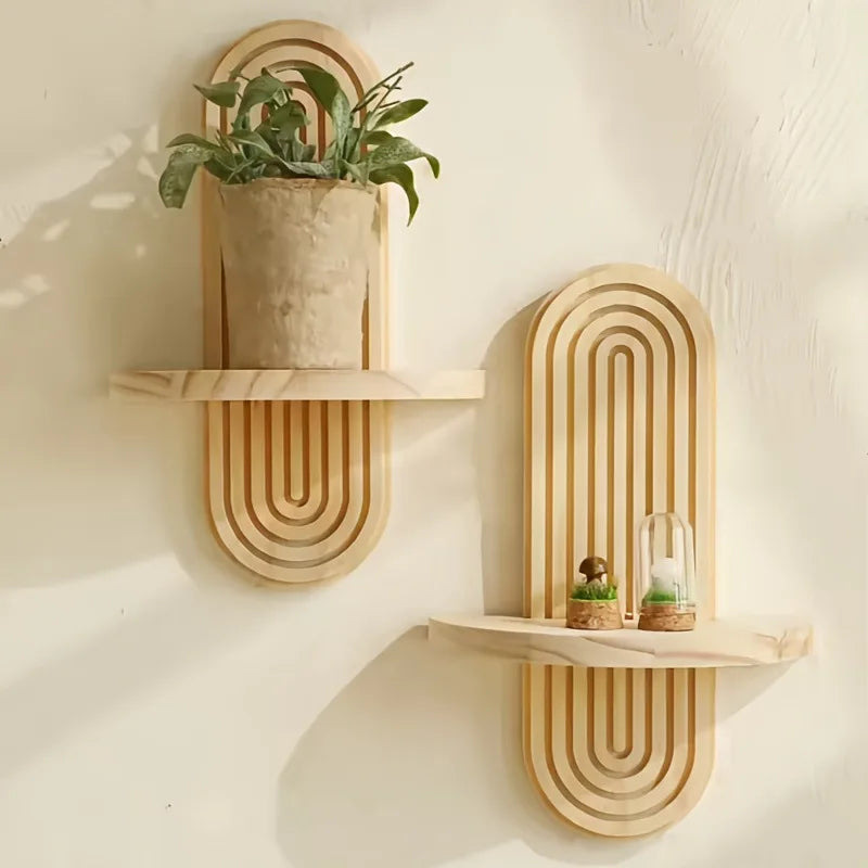 Natural arched boho wooden wall shelves by Nutshell featuring two light wood floating shelves with plant and terrariums