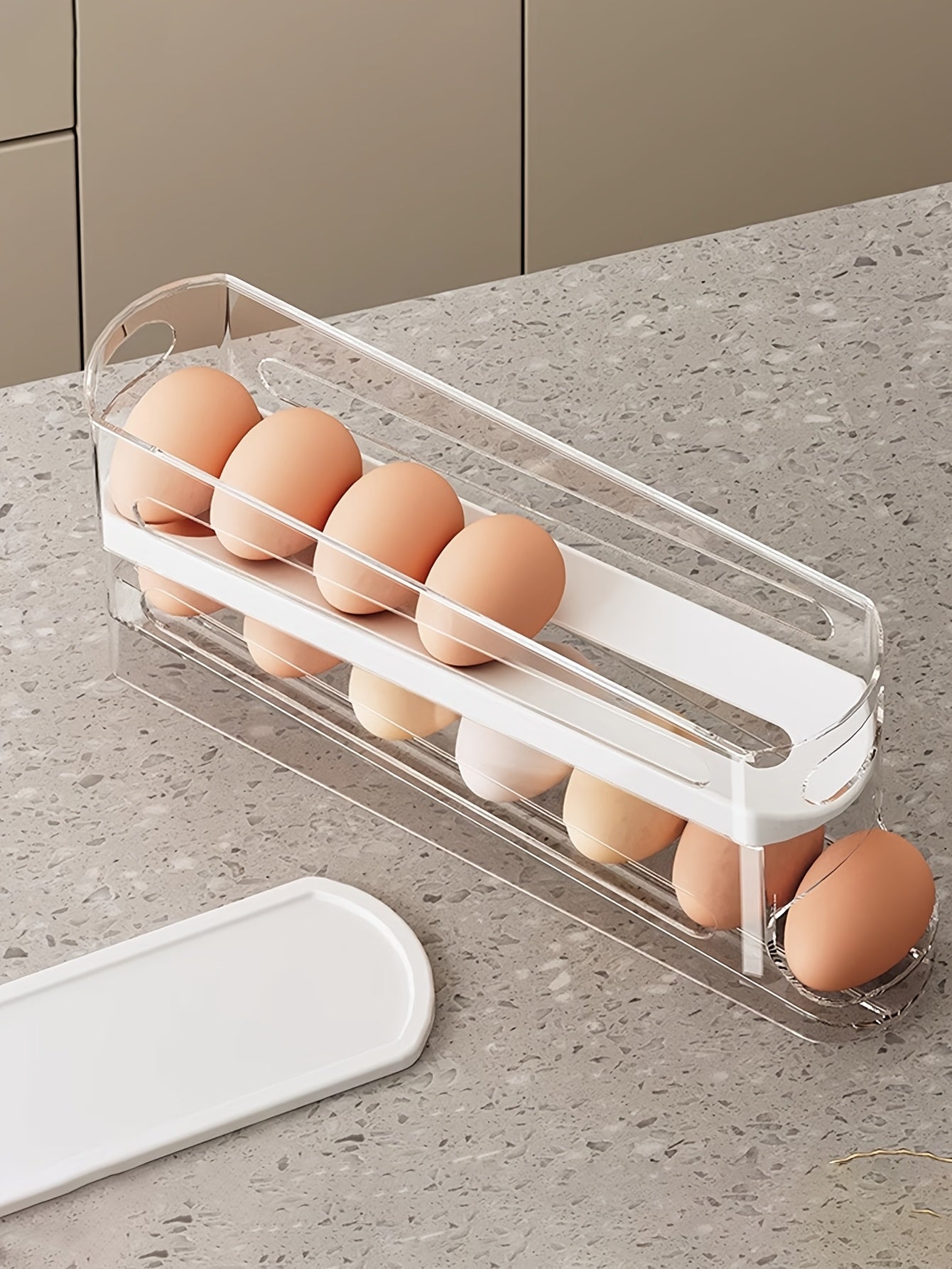Nutshell automatic egg storage container holding multiple eggs for efficient kitchen organization