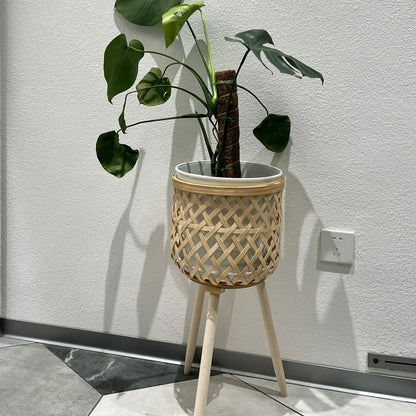 Bamboo Woven Flower Stand with legs showcasing a potted plant for stylish home decor