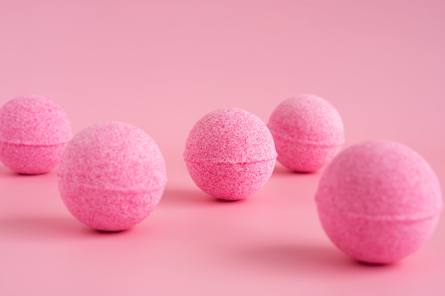 Set of five pink Bath Fizz Bon Bon bath bombs for a relaxing spa experience