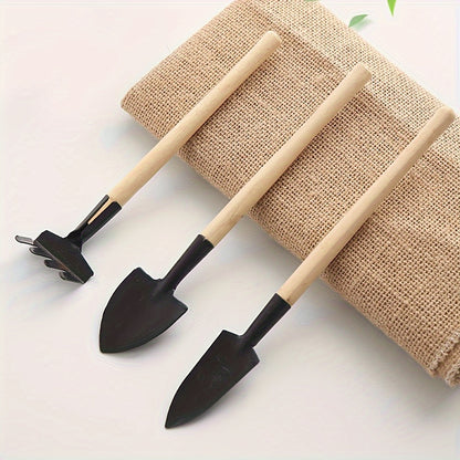 Nutshell Black 3 Tier Wooden Pot Plant Stand Storage Rack displaying tools and a natural fiber backdrop