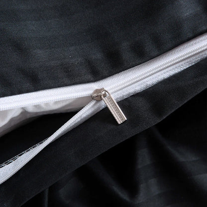 Close-up of zipper detail on Nutshell black satin duvet cover set showing smooth fabric texture