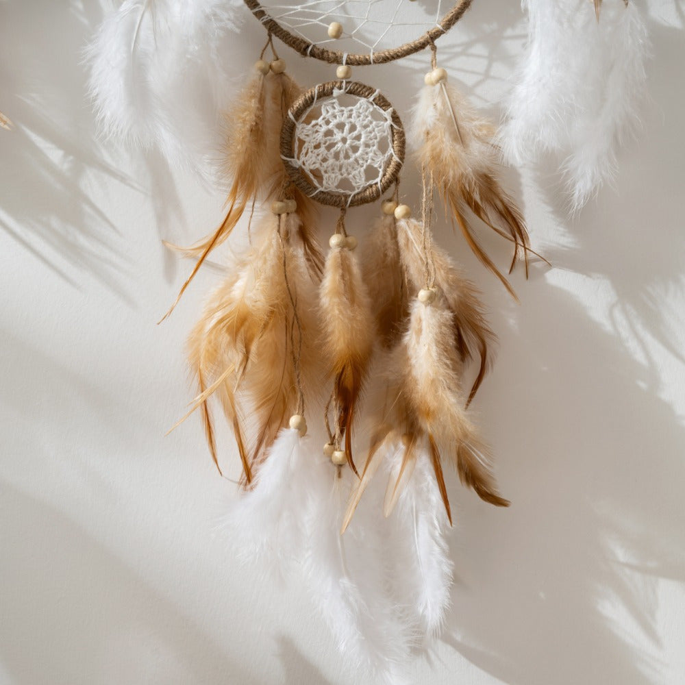 Nutshell bohemian dreamcatcher wall hanging with feathers and lace accents for a stylish home decor