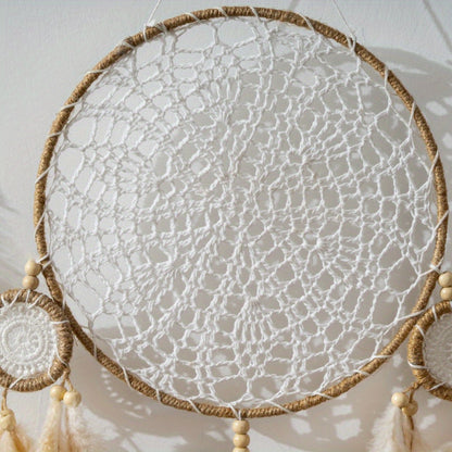 Bohemian dreamcatcher wall hanging with intricate crocheted design and wooden beads for home decor