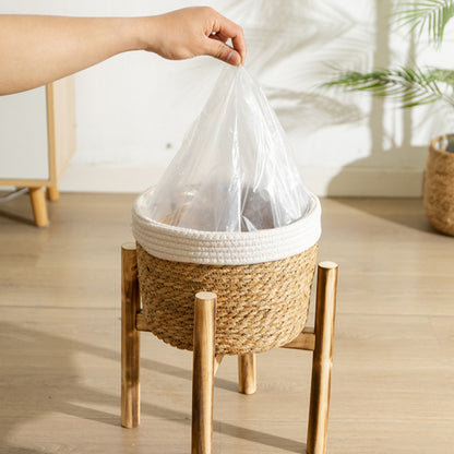 Bohemian Woven Planter With Legs featuring a hand placing a plastic liner inside for easy planting