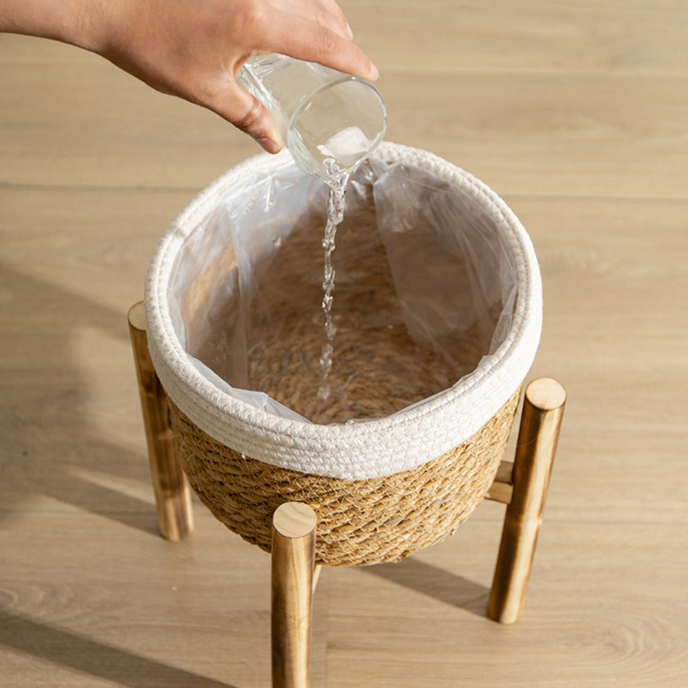 Bohemian Woven Planter With Legs being filled with water for indoor plants