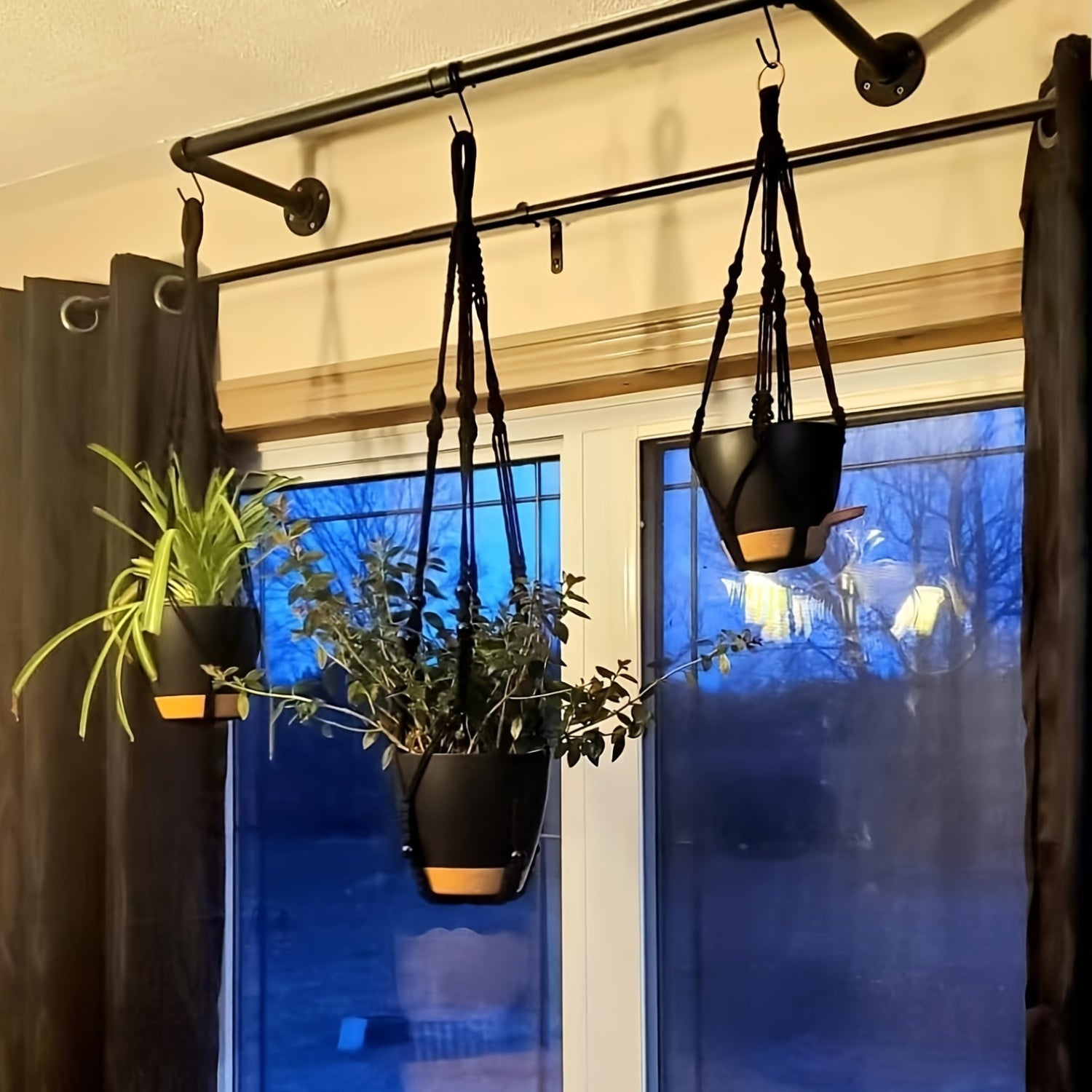 Boho Macrame Plant Hangers Self-Watering Hanging Baskets with elegant plants showcased by a window