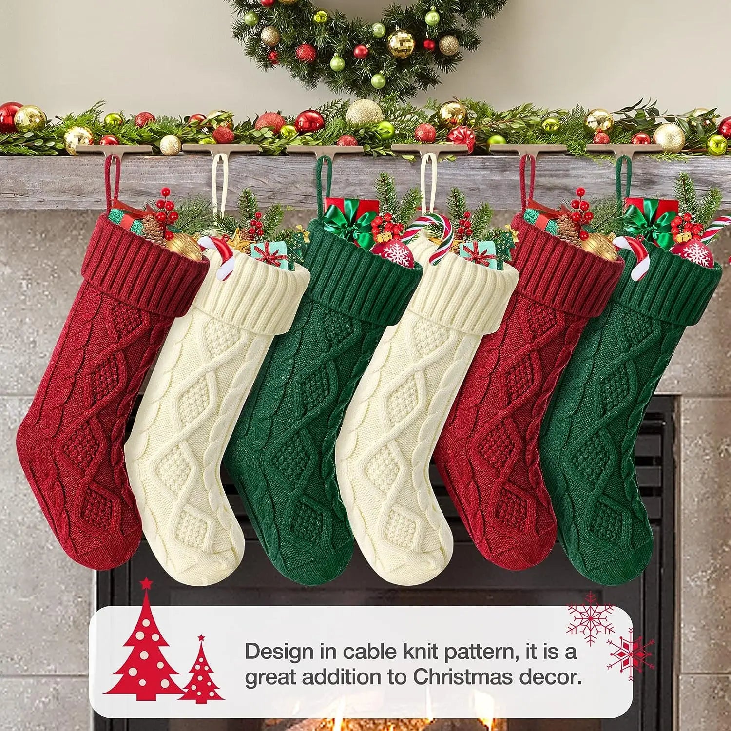 Set of cable knit Christmas stockings in red, green, and cream hanging by a festive fireplace