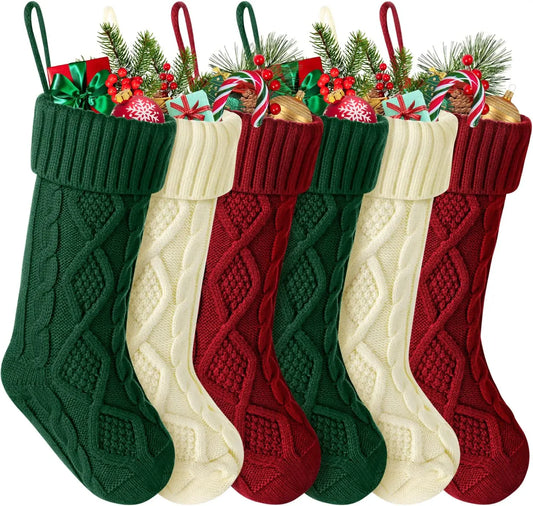 Set of cable knit Christmas stockings in green, red, and white, perfect for holiday decorations