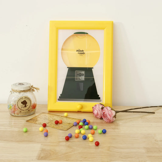 Nutshell candy dispenser picture frame with colorful gumball design and decorative display elements