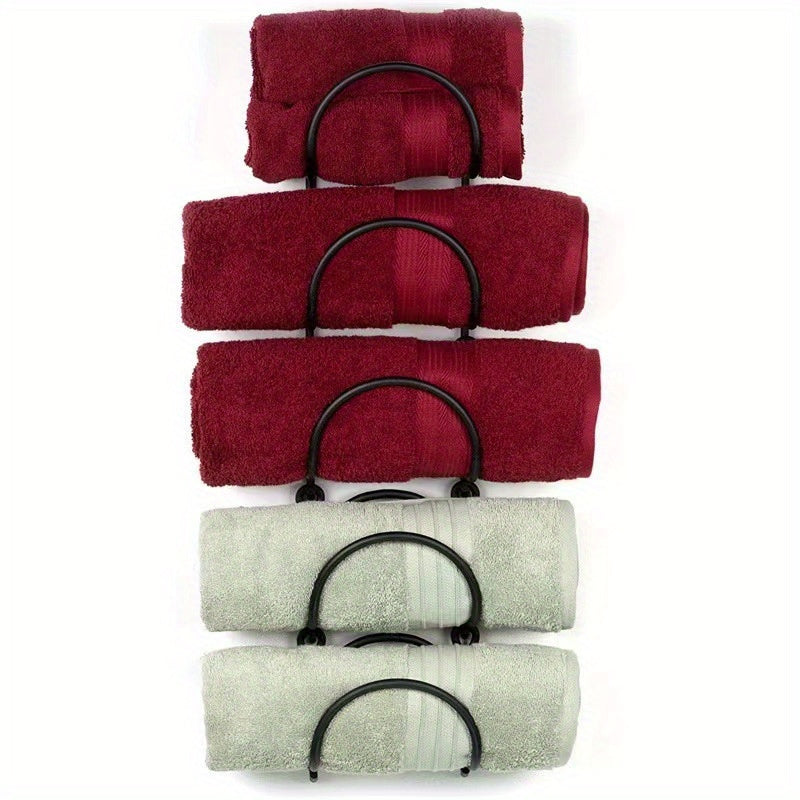 Nutshell bathroom organiser featuring cast iron towel racks for neatly stacked towels