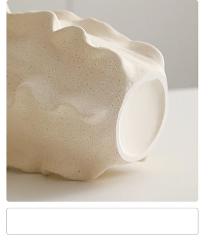 Nutshell ceramic conch design vase in natural beige textured finish close-up view