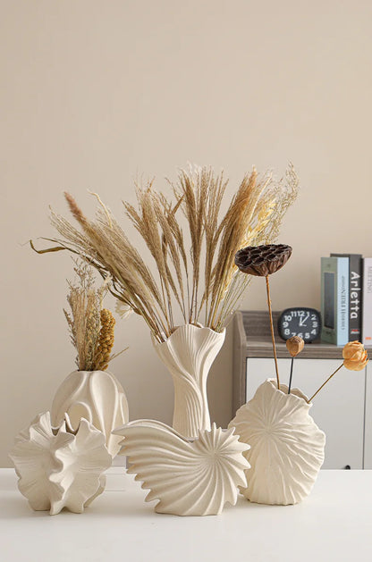 Nutshell ceramic conch design vase set in neutral beige with dried floral arrangements