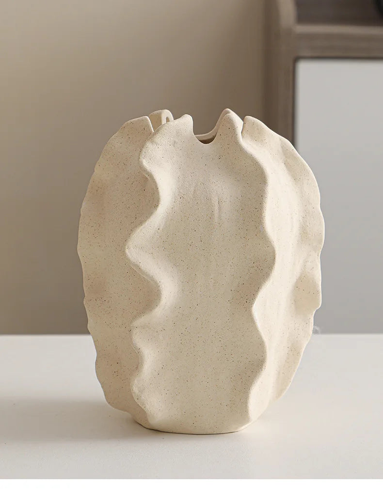 Nutshell ceramic conch design vase in natural beige with wavy textured surface for home decor