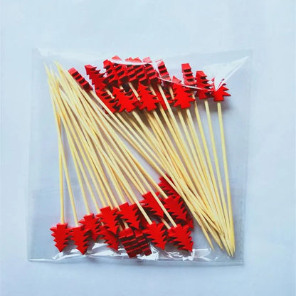 Christmas bamboo fruit sticks with red tree-shaped tops perfect for holiday parties and decorations