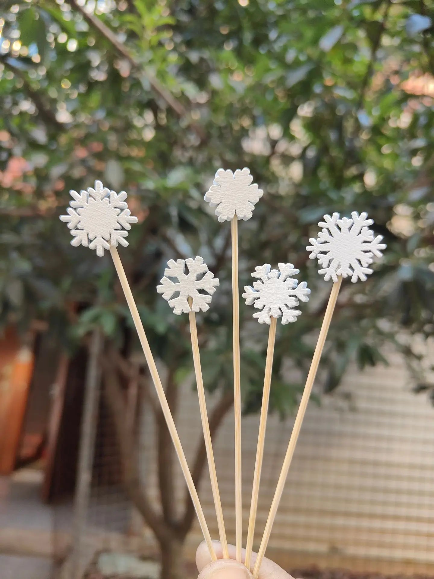 Christmas bamboo fruit sticks with decorative snowflake toppers for festive events