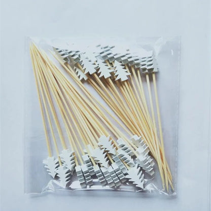 Christmas bamboo fruit sticks in a pack with decorative tree-shaped tops for festive gatherings