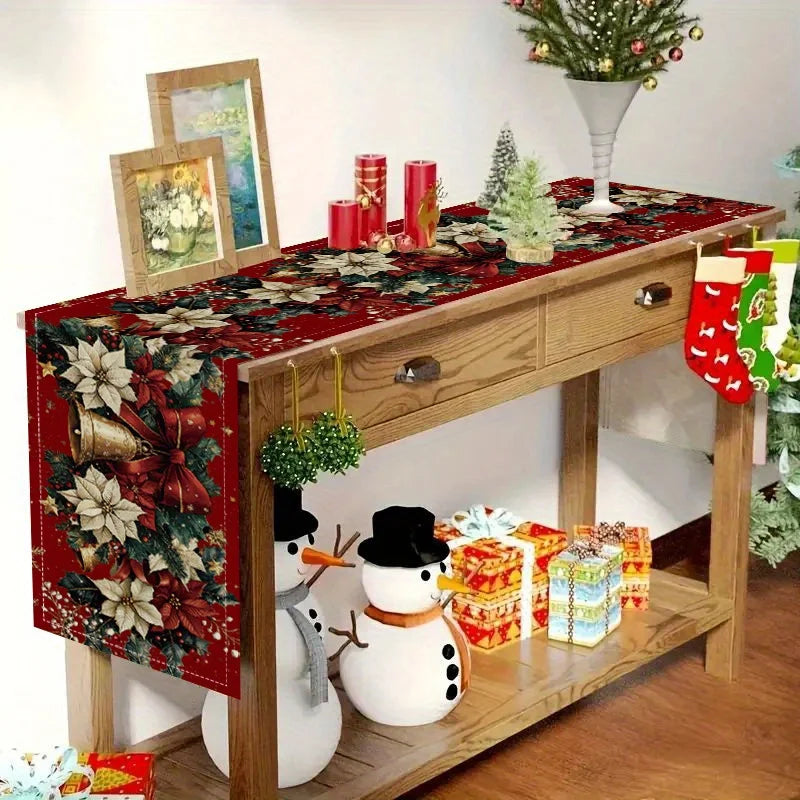 Christmas bells table runner displayed on a wooden table with snowmen and festive decorations