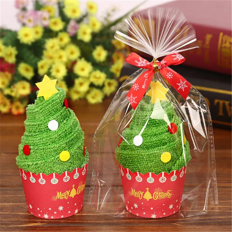Christmas cake shaped hand towels in decorative cups with colorful ornaments and a star on top