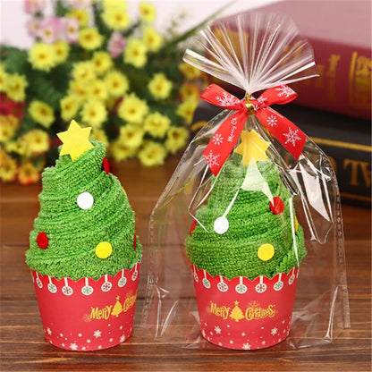 Christmas cake shaped hand towels in decorative cups with colorful ornaments and a star on top