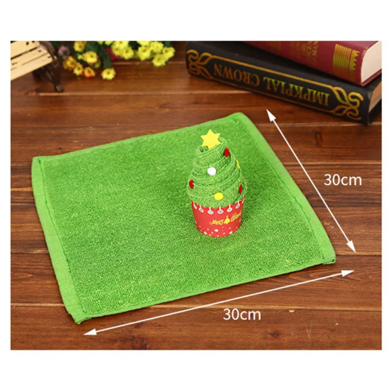 Christmas cake shaped hand towels in festive green with a decorative Christmas tree design
