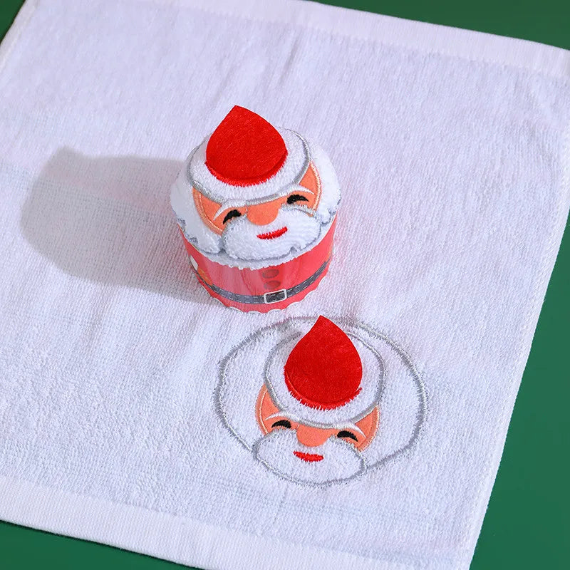 Christmas cake shaped hand towels featuring a Santa design and festive colors for holiday decor