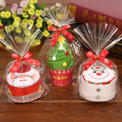 Christmas cake shaped hand towels packaged with festive designs for holiday decor and gift giving