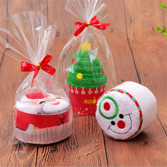 Colorful Christmas cake shaped hand towels in festive packaging for holiday gifting