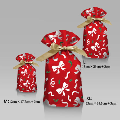 Nutshell Christmas candy gift bags in three sizes with festive red design and gold ribbon accents
