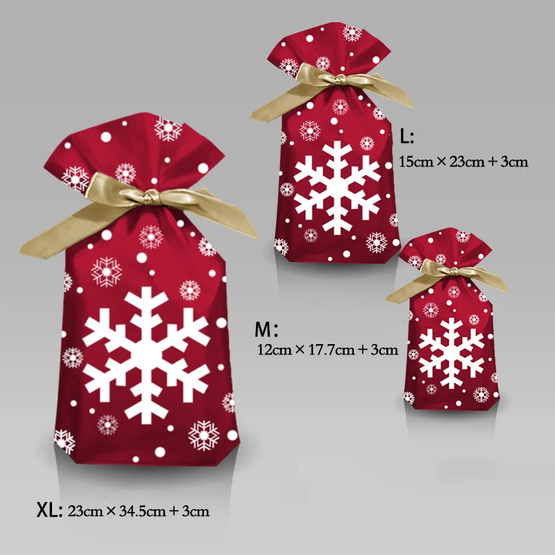 Christmas candy gift bags in three sizes with red snowflake design and golden ribbons