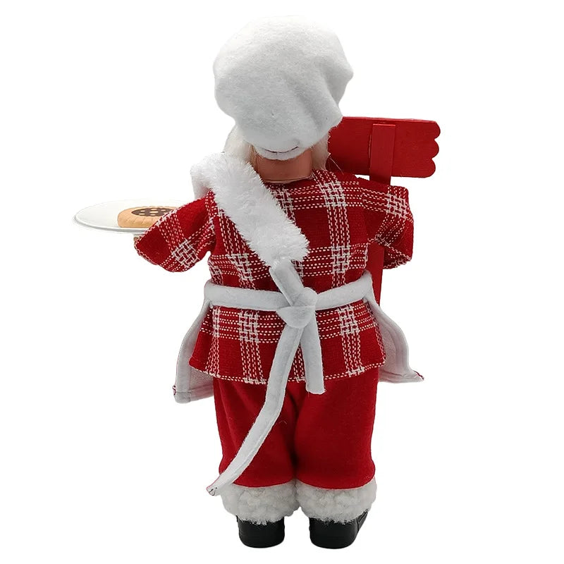 Nutshell Christmas chef Santa Claus decoration holding a plate of cookies in festive attire