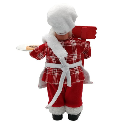 Nutshell Christmas chef Santa Claus decoration holding a plate of cookies in festive attire
