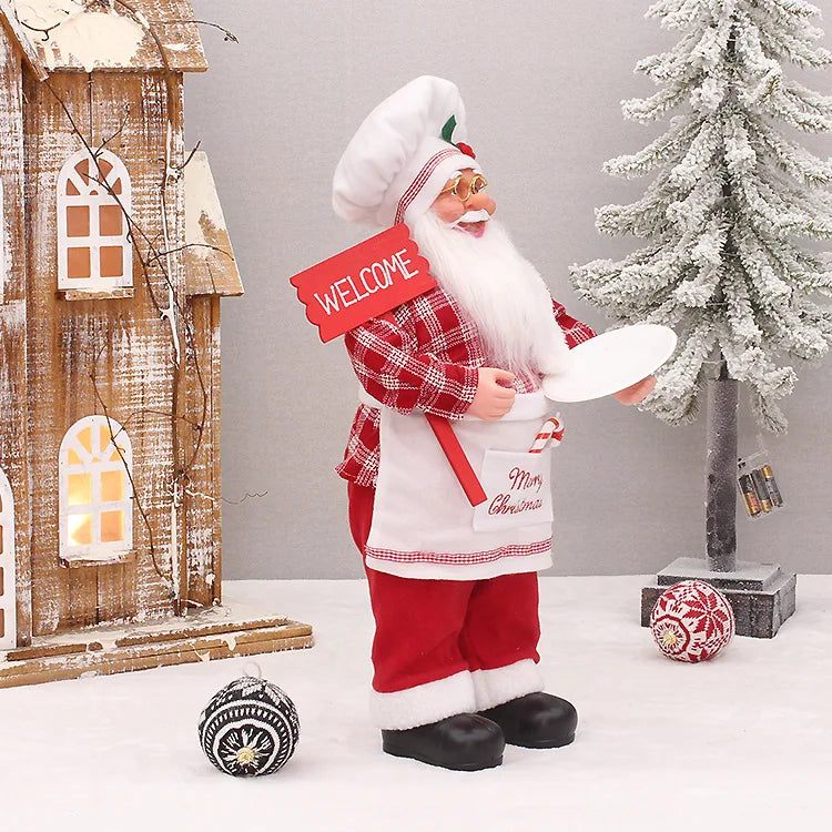 Nutshell Christmas chef Santa Claus decoration holding a welcome sign in a festive setting