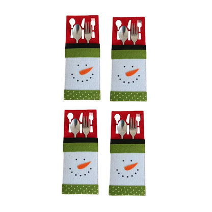 Set of four Christmas cutlery holders featuring snowman design for festive table settings