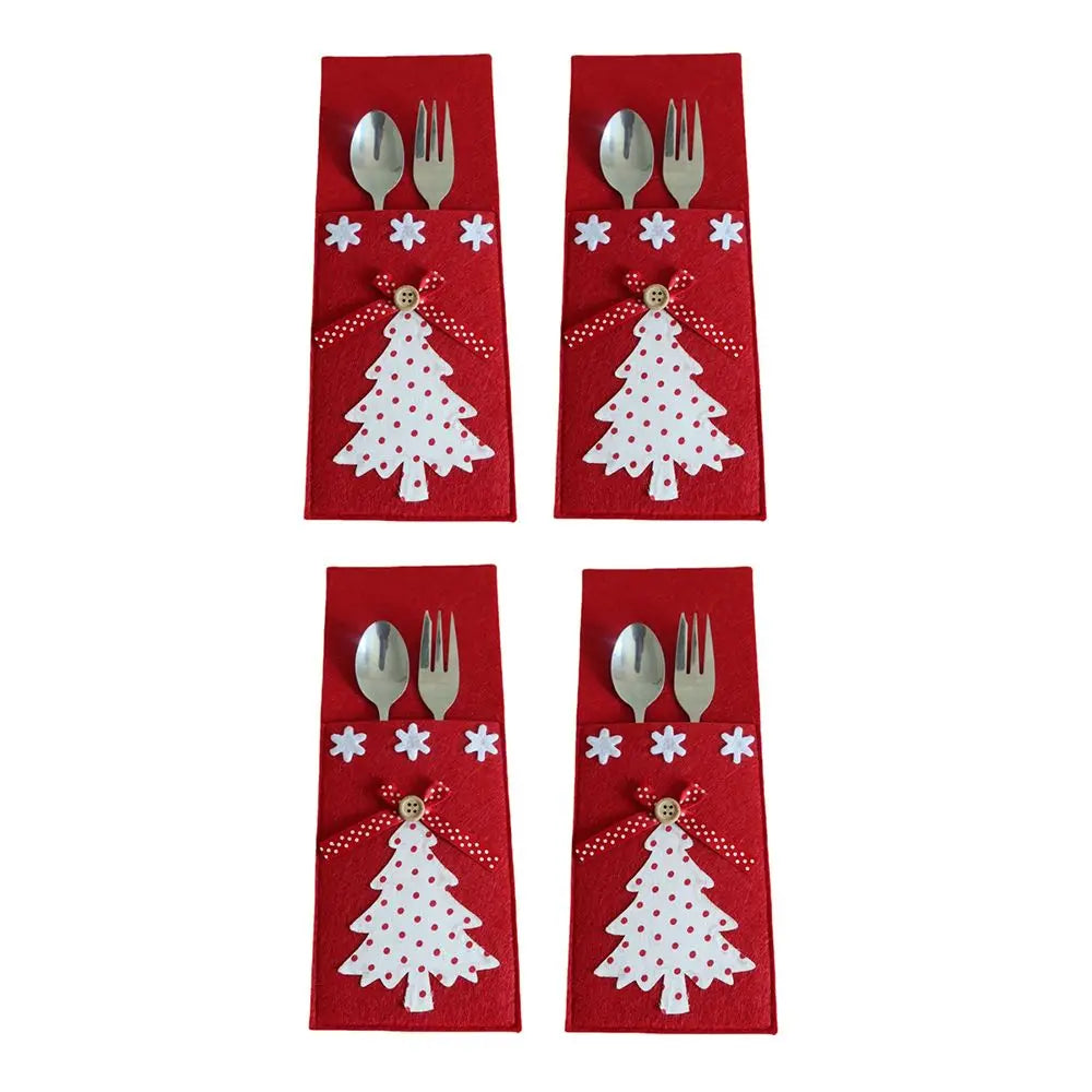 Set of four Christmas cutlery holder with tree design and decorative accents for festive table settings