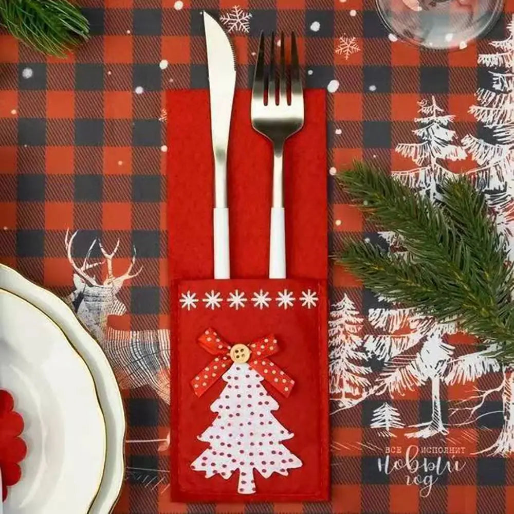 Christmas cutlery holder in red with a white tree design for festive table settings