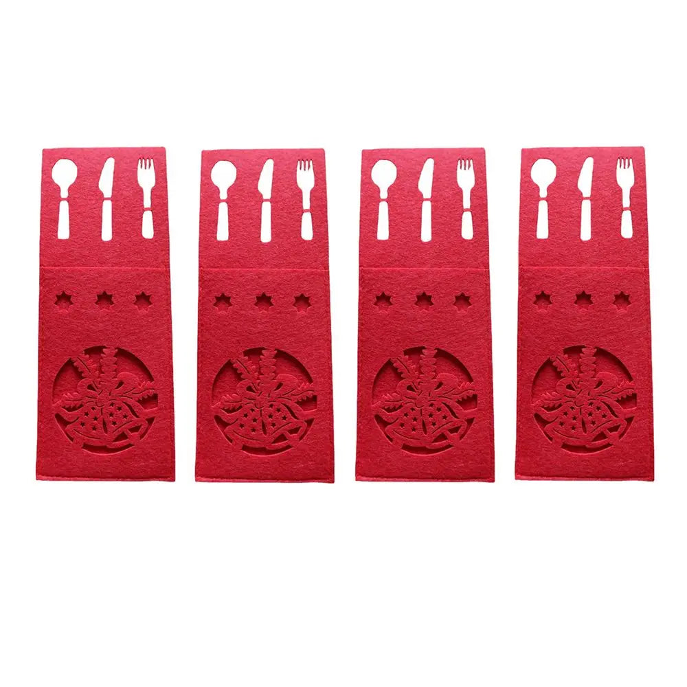 Set of four red Christmas cutlery holder with festive cutout designs for holiday dining decor