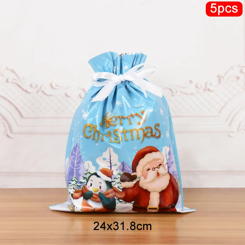 Set of Christmas drawstring gift bags featuring Santa and a snowy design, perfect for holiday gifting