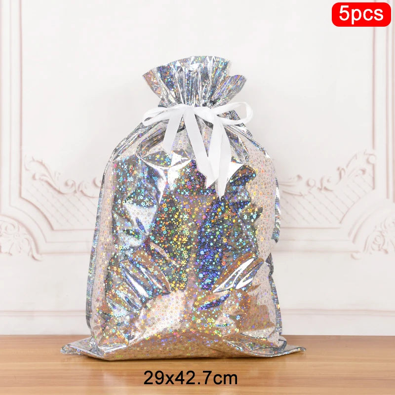 Glittery silver Christmas drawstring gift bags measuring 29x42.7cm, perfect for holiday gifting