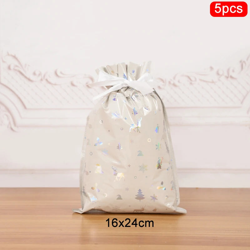 Set of 5 Christmas drawstring gift bags in silver with festive patterns and a ribbon closure