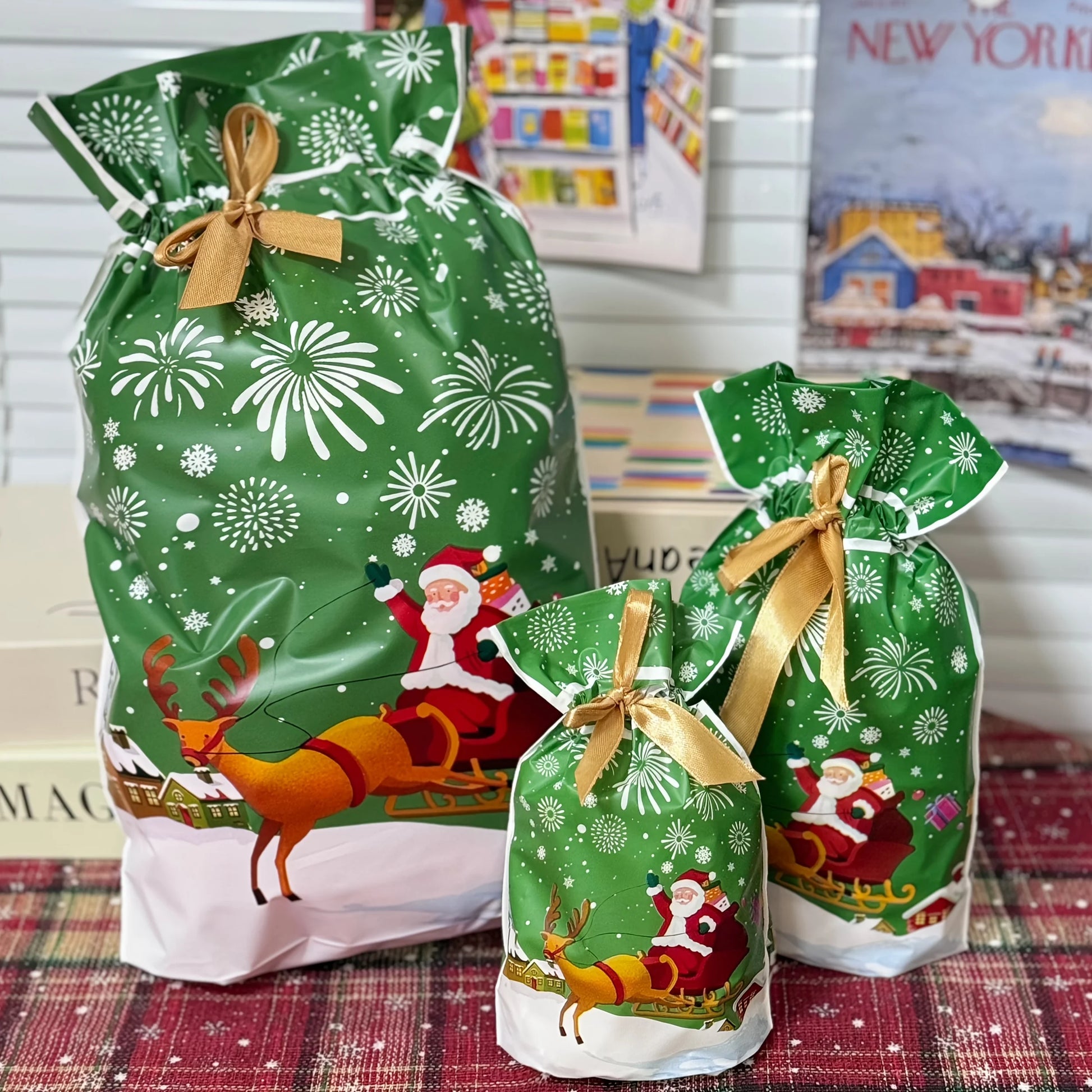 Nutshell Christmas drawstring gift bags large featuring festive Santa and reindeer design in vibrant green