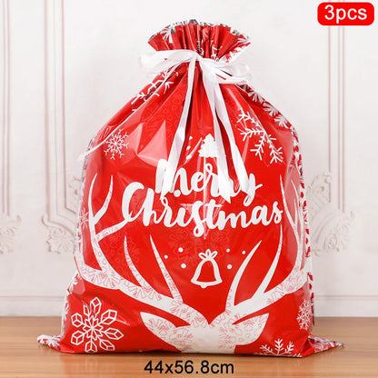Set of 3 Christmas drawstring gift bags in red with festive antler design and 'Merry Christmas' print