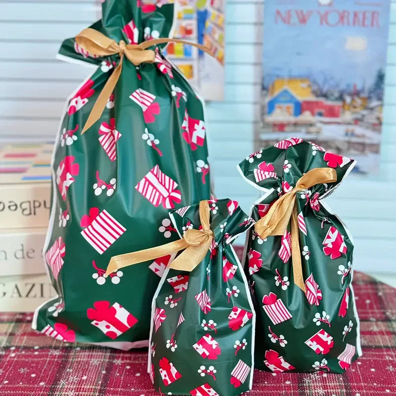 Set of Christmas Drawstring Gift Bags with Ribbon in festive green and red design for holiday gifting
