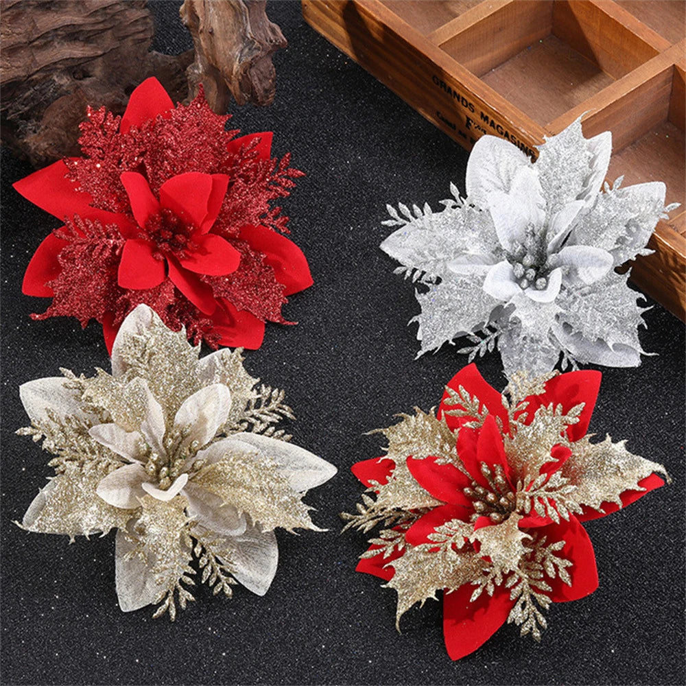 Set of Christmas flower ornaments in red, white, and gold for festive holiday decorations