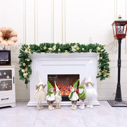 Nutshell Christmas Garland decorated on a fireplace with whimsical gnome figures and festive accents