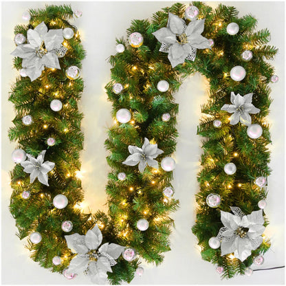 Nutshell Christmas garland with lights featuring silver flowers and decorative ornaments