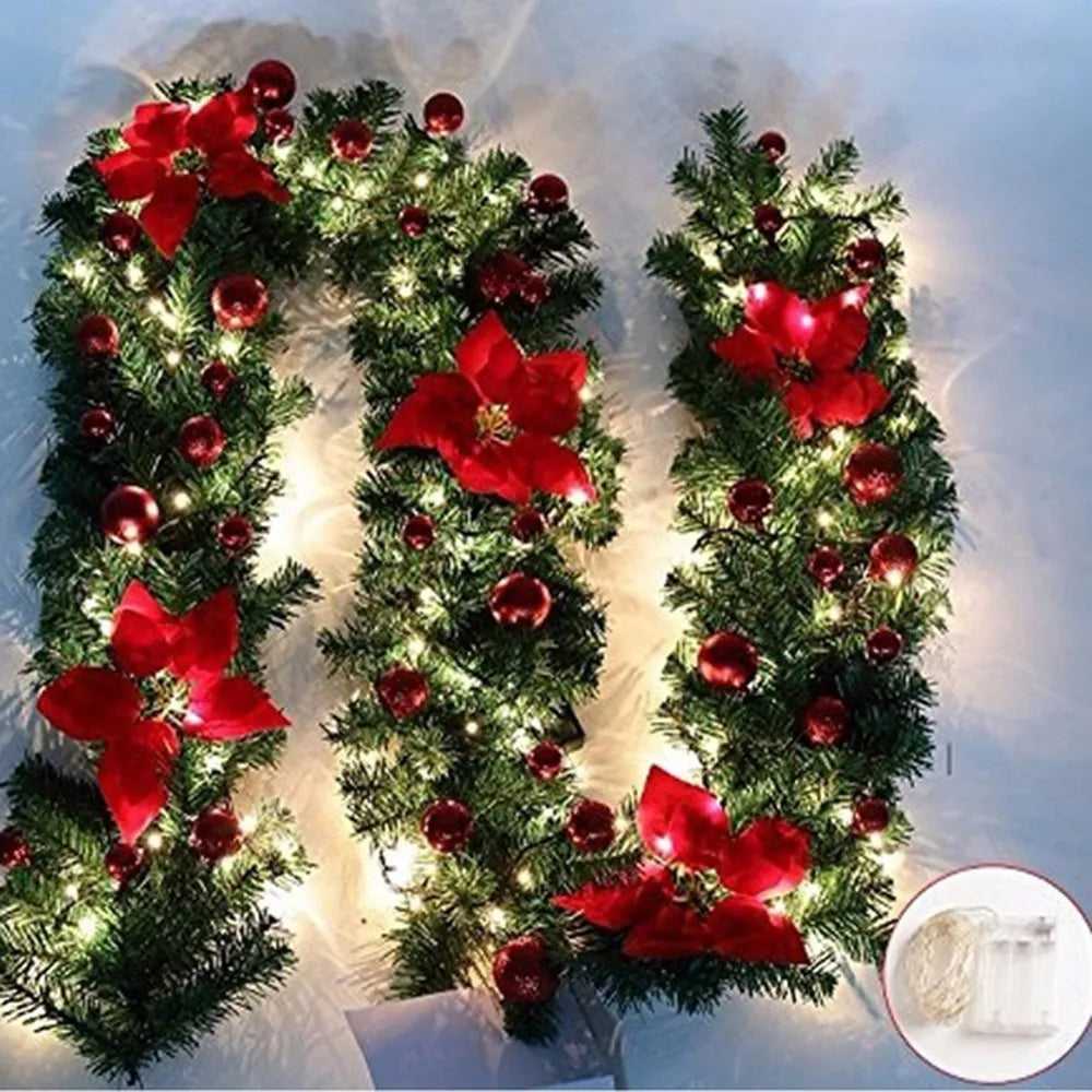 Nutshell Christmas garland with lights featuring red flowers and ornaments for festive decor