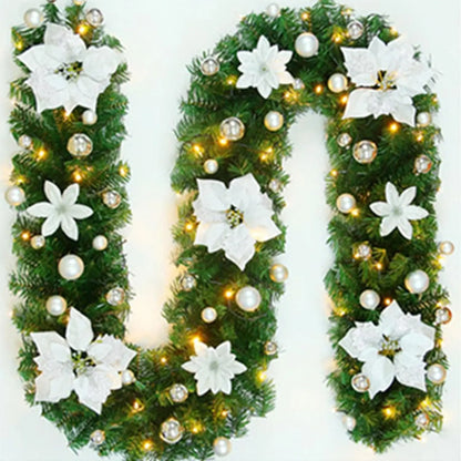 Nutshell Christmas garland with lights featuring white flowers and gold ornaments for festive decoration